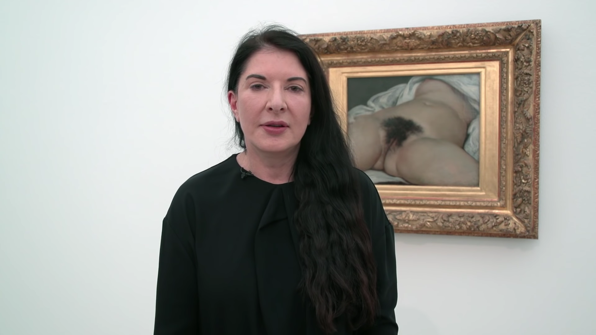 Marina Abramović in front of Gustave Courbet's Origin of The World