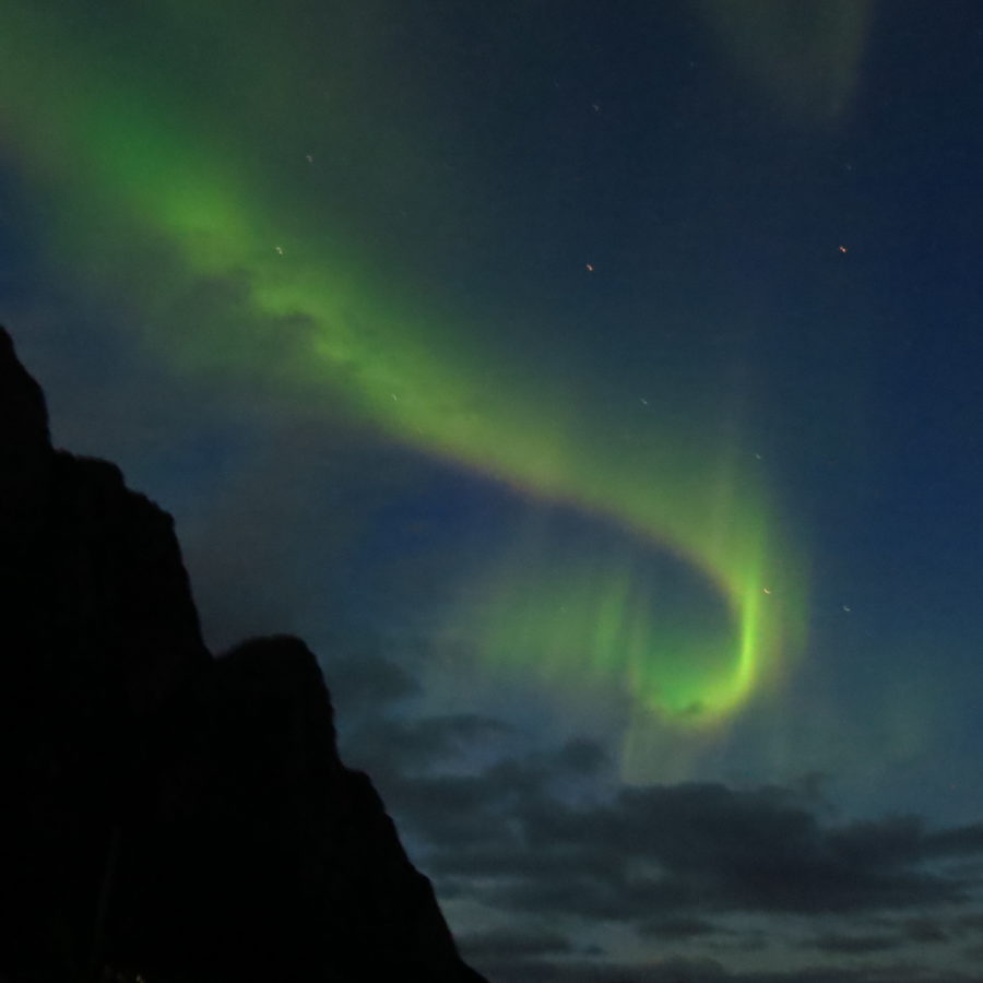 21st Century Grand Tour: Northern lights from a beach, Lofoten Islands, Norway.