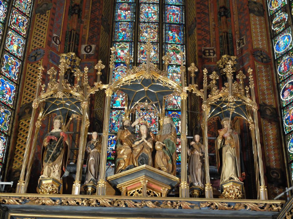Veit Stoss, St. Mary's Altar, 1489, detail of relief predella at the tallest point of the altarpiece. We see the Coronation of Mary, attended by two angels and the primary Polish national saints - Adalbert and Stanislaus, St Mary's Altarpiece