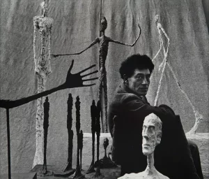 Alberto Giacometti with some of his sculptures, 1951, photograph by Gordon Parks, Foundation Giacometti, Paris, France.