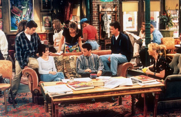 Art in Friends In one of the first seasons, there is a poster with a caricature or teh Statue of Liberty holding a large, steaming cup. Source: Imdb.