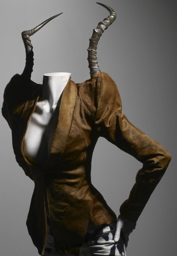 Alexander McQueen, It's A Jungle Out There collection, F/W 1997-8, Ensemble, jacket of brown pony skin with impala horns; trousers of bleached denim, Source: The Metropolitan Museum of Art, New York, USA. 
