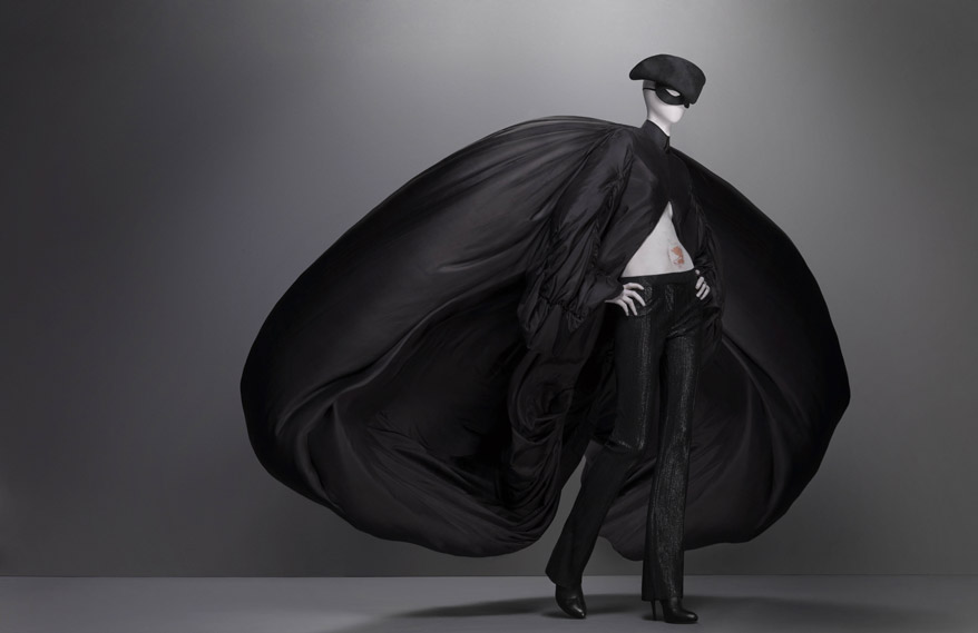 Alexander McQueen, Supercalifragilisticexpialidocious collection, F/W 2002-3, Ensemble, coat of black parachute silk; trouser of black synthetic; hat of black silk satin, hat by Philip Treacy for Alexander McQueen, Source: The Metropolitan Museum of Art, New York, USA. 