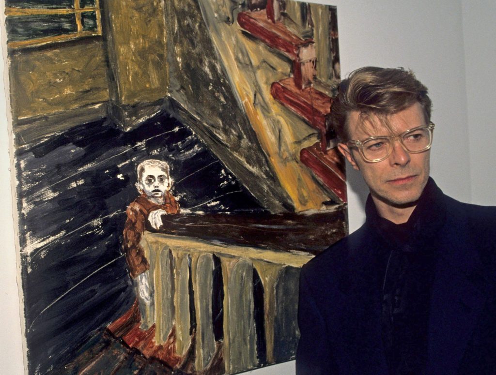 David Bowie Paintings. David Bowie with his painting Child in Berlin, 1977, photograph by Kevin Mazur