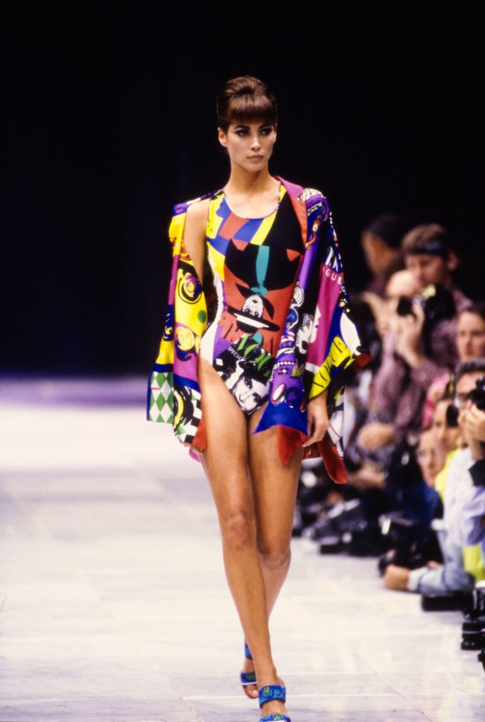 Gianni Versace, bathing suit and overcoat, SS 1991, Source: Vogue.