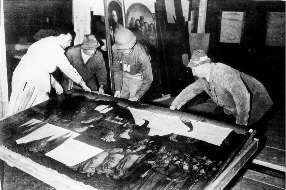 Monuments Man George Stout moving the central panel of the Ghent Altarpiece in Altaussee, Austria in July of 1945. Photograph: AP Photo/National Archives and Records Administration) van eyck exhibition van eyck an optical revolution