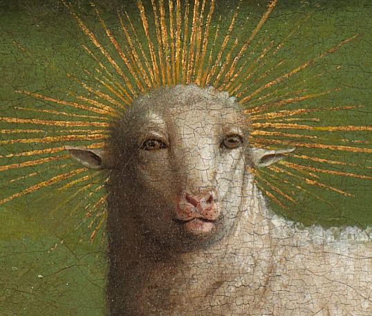 A disturbing but now legendary face of the Mystic Lamb revealed after the restoration of the Ghent Altarpiece. van eyck exhibition van eyck an optical revolution