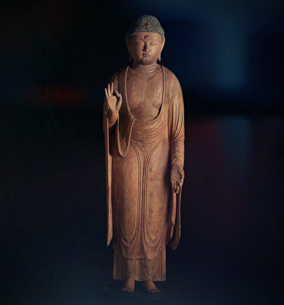 buddhist art, standing wooden sculpture of the deity Buddha Amitabha