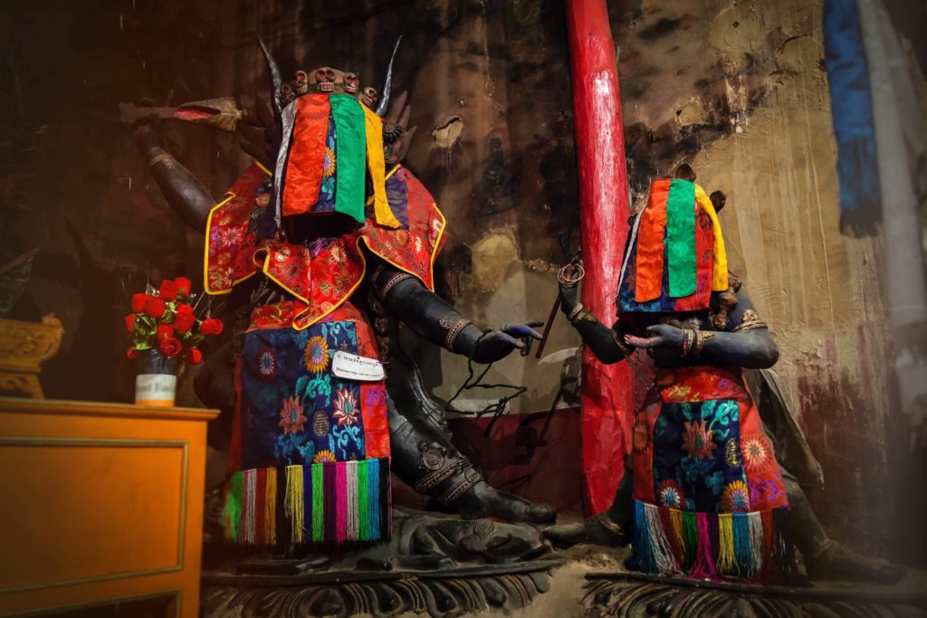 Inside the gonkhang or room with wrathful deities who are covered with brightly colored cloth