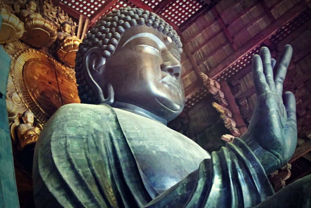 Buddhist art, close up of the giant figure of the deity Buddha Vairochana