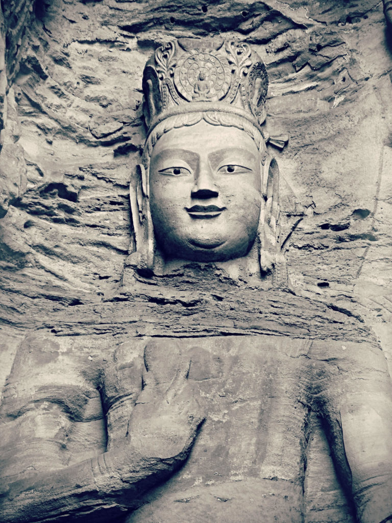 giant figure of the deity bodhisattva cut in the mountain