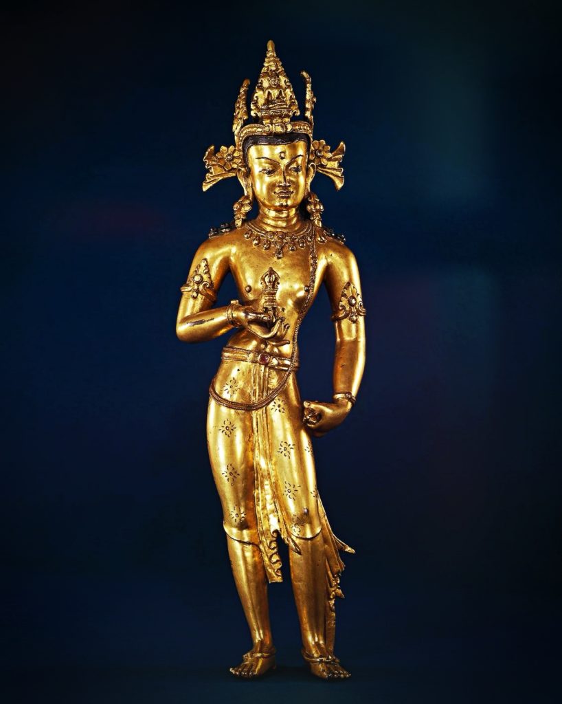 standing bodhisattva Vajrasattva adorned with jewelry and hold vajras