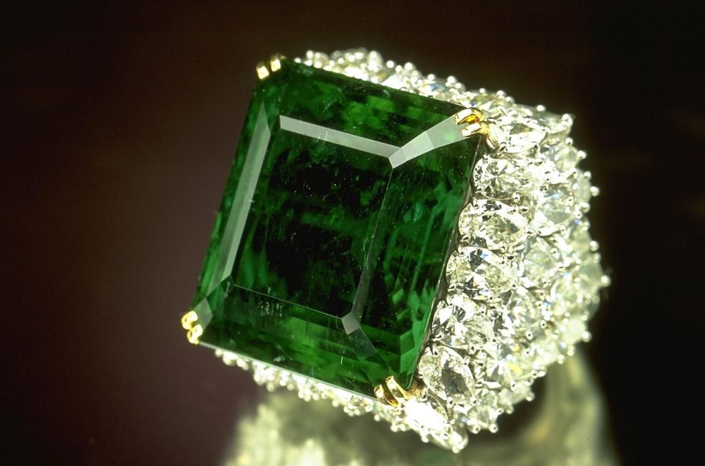 unique emerald jewelry: emerald ring with diamond accents 