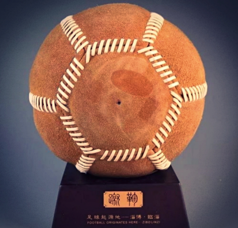 Modern Sports Played in Ancient China, the toy model of a cuju game with several players and a ball in the game