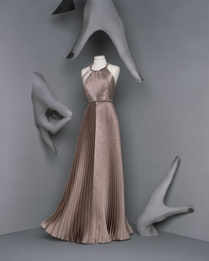 Dior AW 2020-21: Deconstructing Art References. Long “Peplum” dress in greige pleated crepe satin, © Brigitte Niedermair, Courtesy of Dior.