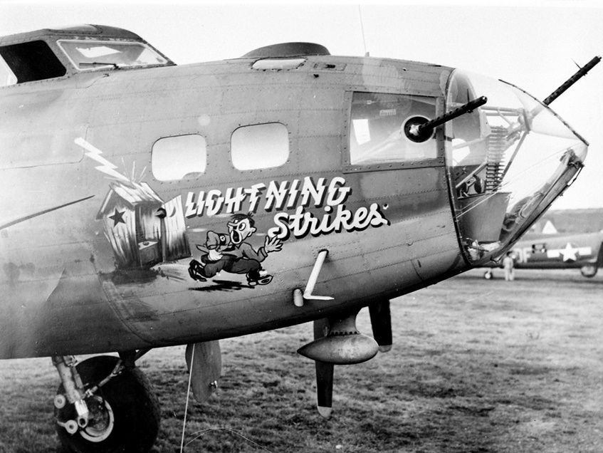 Nose Art by pilots: B-17 Bomber "Lightning Strikes" with Hitler running out of a latrine