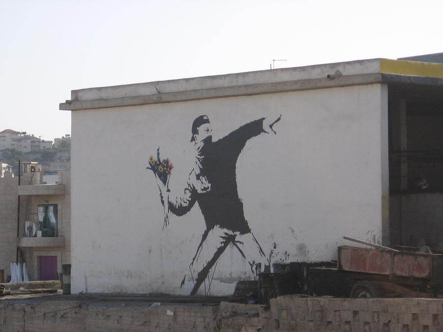 Banksy city guide 2021: Banksy, Love is in the Air or Flower Thrower, 2003