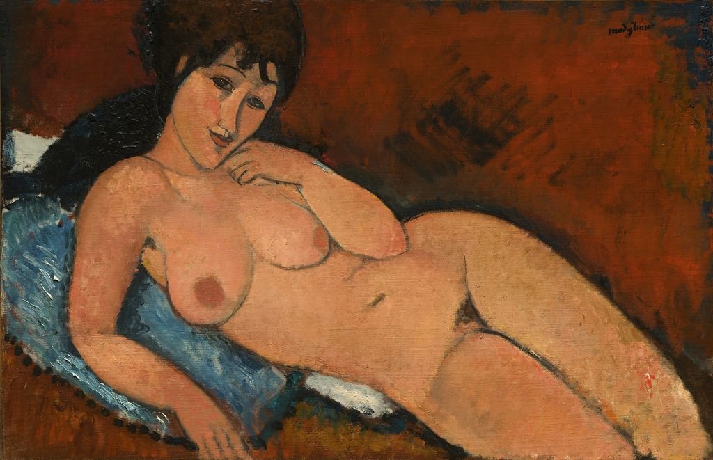 Berthe Weill Amedeo Modigliani, Nude on a Blue Cushion, 1917, National Gallery of art, Washington D.C A naked woman is lying on her back, facing the spectator who she is watching. A blue cushion is under the high half of her body. 