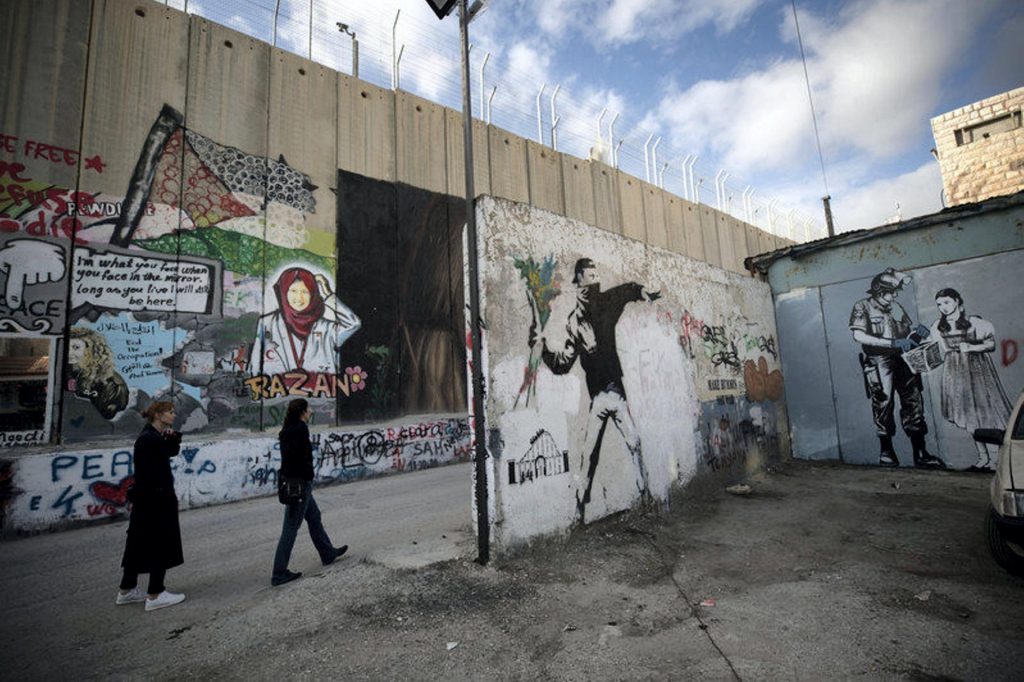 Banksy's work in Betlehem, Palestine.