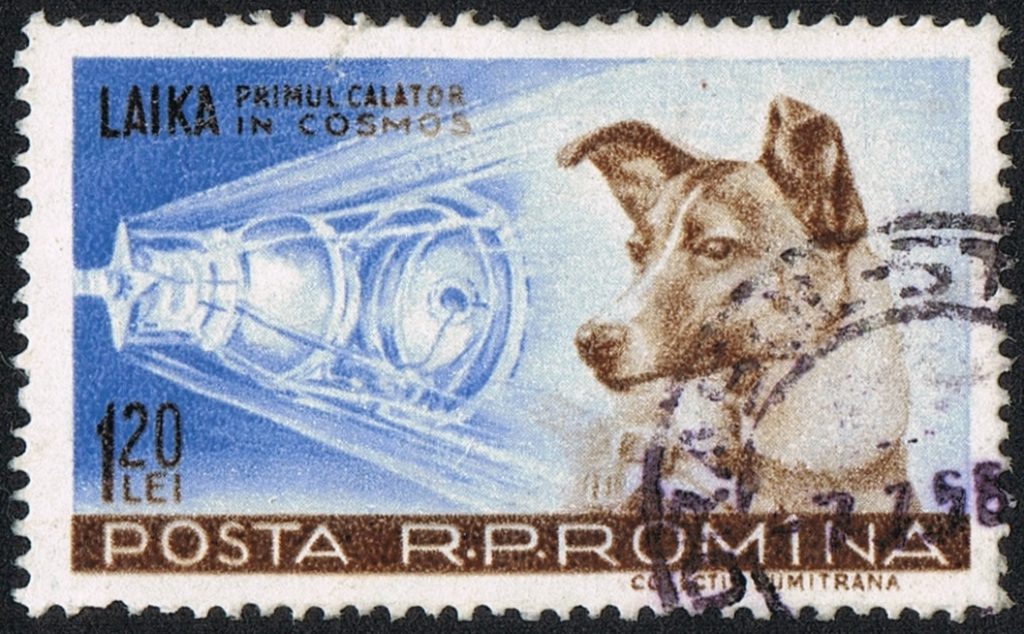 Romanian post stamp with Laika next to a Sputnik-2 spacecraft