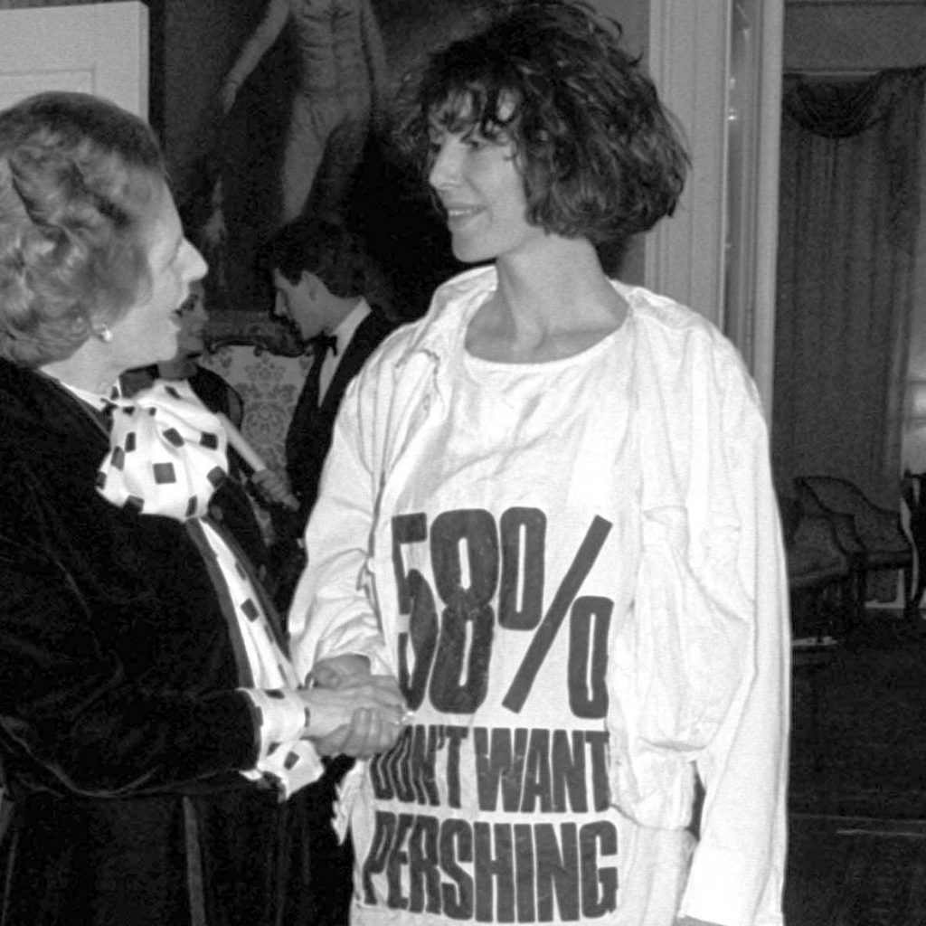 Katharine Hamnett meets UK Prime Minister Margaret Thatcher wearing a nuclear missile protest t-shirt