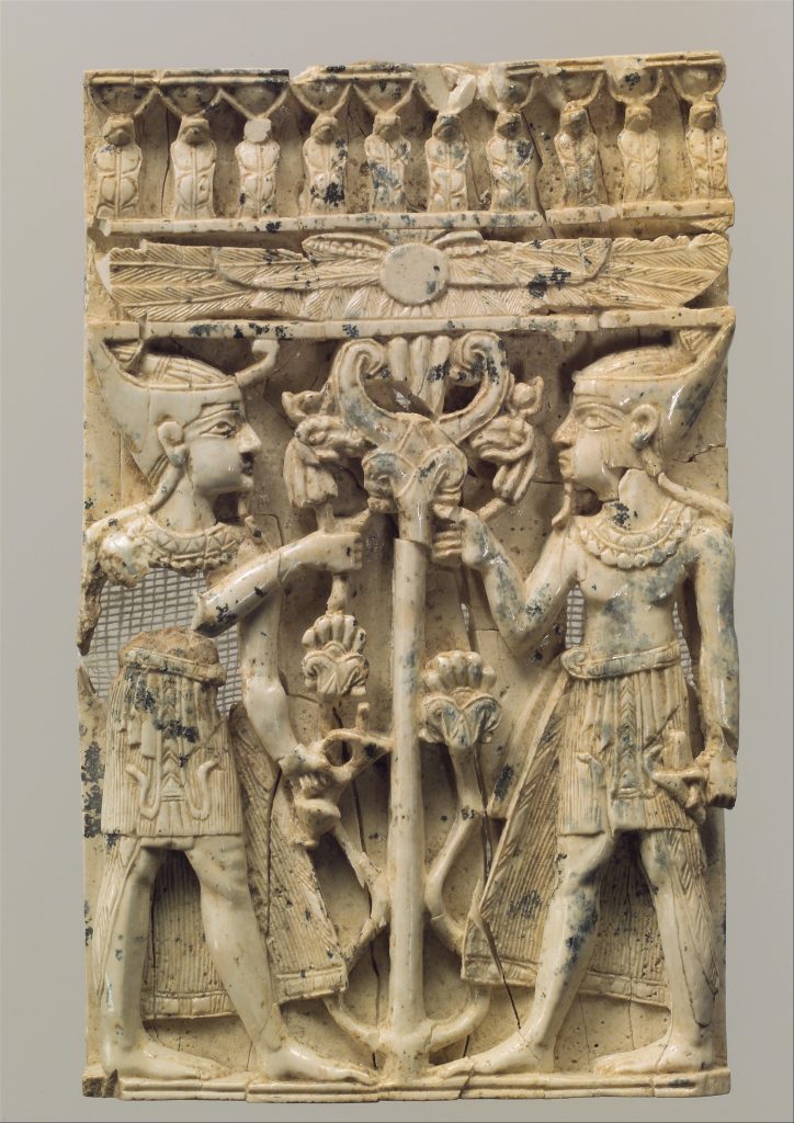 Furniture plaque carved in high relief with two Egyptianizing figures flanking a volute tree, ivory carving, 9th-8th century BCE, Neo-Assyrian Period, Metropolitan Museum of Art, New York, NY, USA. 