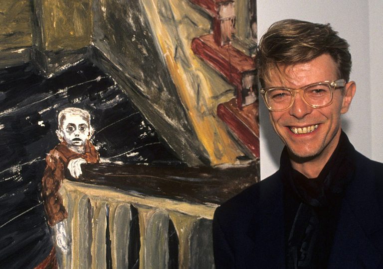 David Bowie Paintings: David Bowie and one of his paintings during an Eduard Nakhamkin Fine Arts Gallery event for The American Cancer Society in 1990 in New York, NY, USA. Photo by Ke.Mazur / WireImage / GettyImages.
