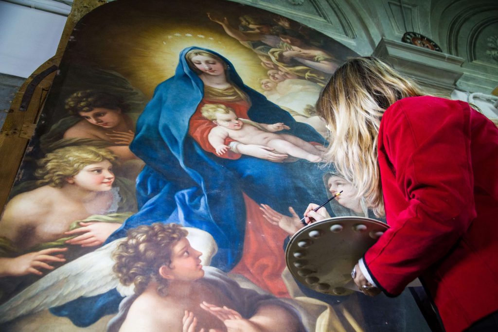 Elizabeth Wicks restoring Madonna by Violante Siries. Advancing Women Artists.