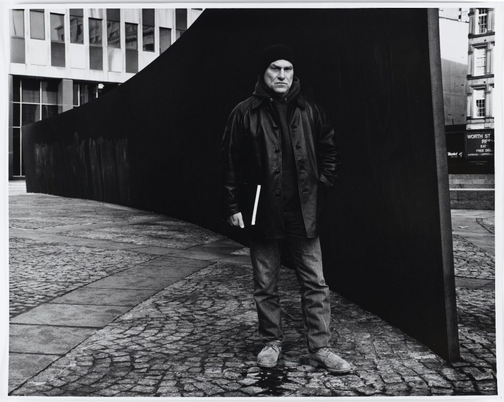 Richard Serra beside his Tilted Arc, 1988, Federal Building Plaza, NY. 