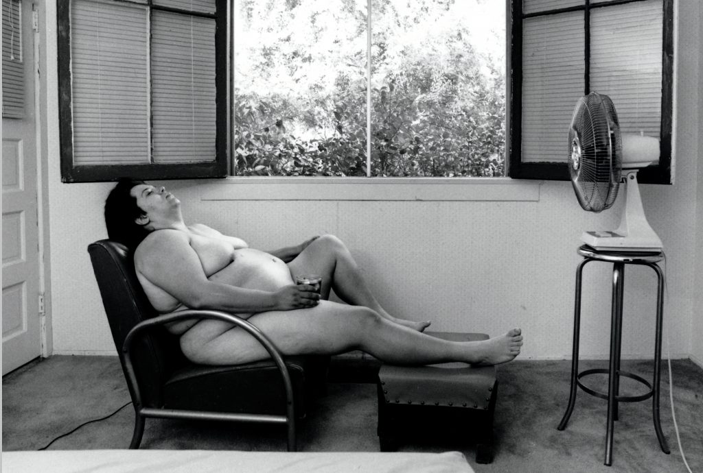 Body in the Art: Laura Aguilar, ​In Sandy's Room,​ 1989, gelatin silver print, 42 x 52 inches, courtesy of the Laura Aguilar Trust of 2016 and the UCLA Chicano Studies Research Center.