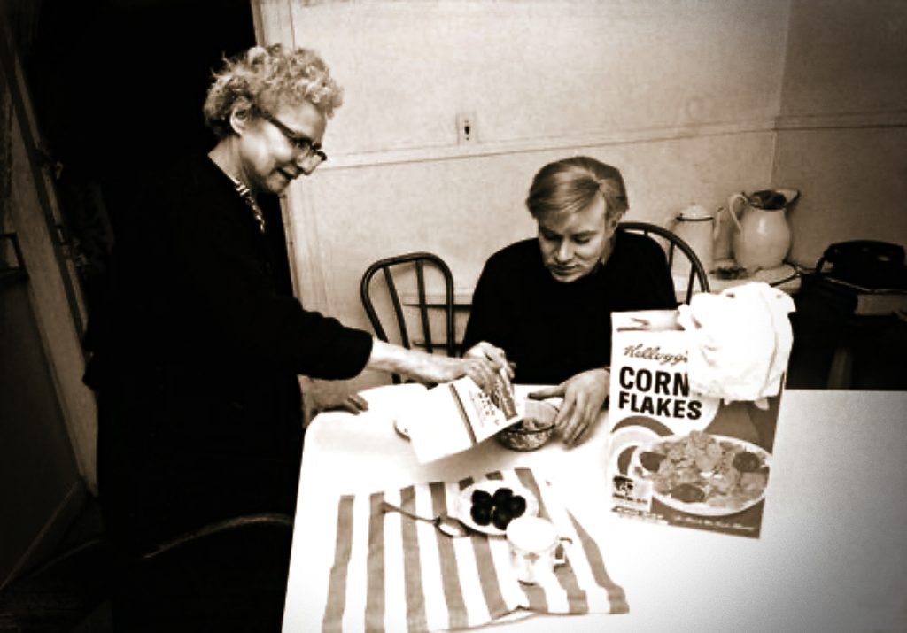 Andy Warhol at home eating Kellogg's Corn Flakes with his mother, Julia Warhol