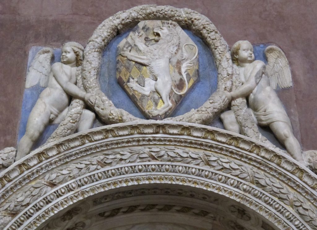 Bernardo Rossellino, Tondo bearing Leonardo Bruni’s coat of arms held by two putti, Tomb of Leonardo Bruni, 1444-1451, Basilica of Santa Croce, Florence, Italy. 