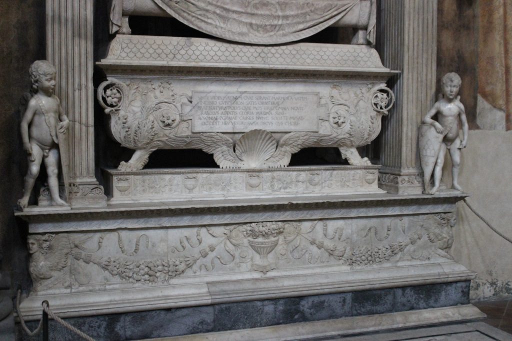 Desiderio da Settignano, Sarcophagus and two putti bearing shields with Carlo Marsuppini’s coats of arms, Tomb of Carlo Marsuppini, Basilica of Santa Croce, Florence, Italy.