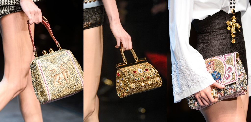 Three handbags by Dolce and Gabbana. Left: with the fragment of mosaic representing Evangelist Mark as a lion. Centre: gold purse with cabochons and gems. Right: handbag with mosaic decoration