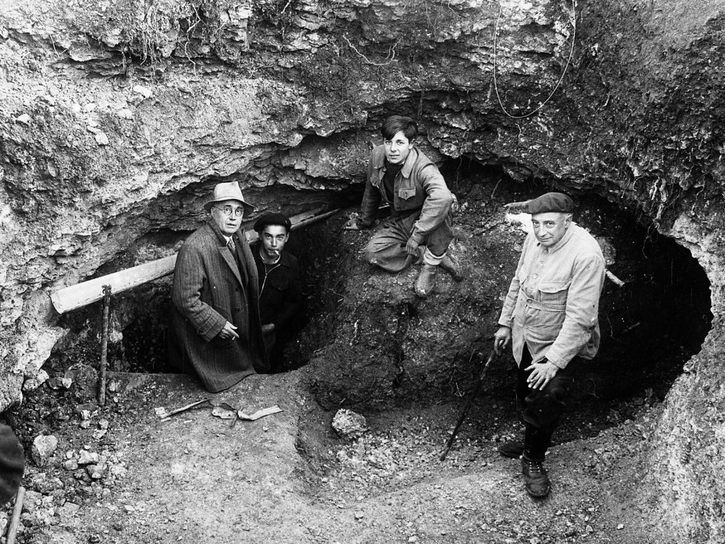 Entrance to the Lascaux Cave in 1940. Left to right: Léon Laval, Marcel Ravidat, Jacques Marsal and Henri Breuil