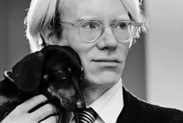 Photo of Andy Warhol with Archie, Whitney Museum of American Art, New York, NY, USA.