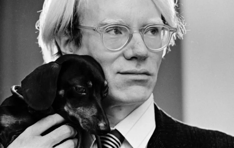 artists Dachshund: Photo of Andy Warhol with Archie, Whitney Museum of American Art, New York, NY, USA.
