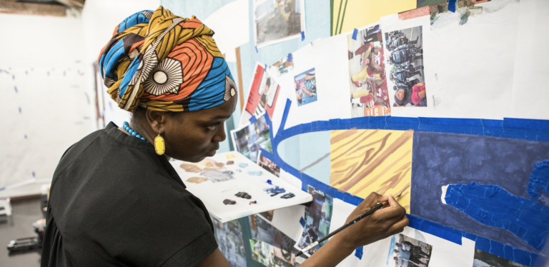 Njideka Akunyili Crosby: Njideka Akunyili Crosby at work. Photograph: Victoria Miro Gallery.
