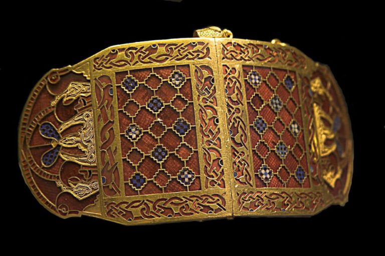 Sutton Hoo ship burial: Shoulder clasp (one of a pair) from the Sutton Hoo ship burial, early 7th century, gold, garnets, and millefiori glass, British Museum, London, UK. Photo by RobRoy via Wikimedia Commons (CC-BY-SA 2.5).
