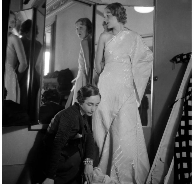 Madame Grès: Madame Grès is creating an evening gown for Macy’s, Paris, August 1933. Elegancepedia.
