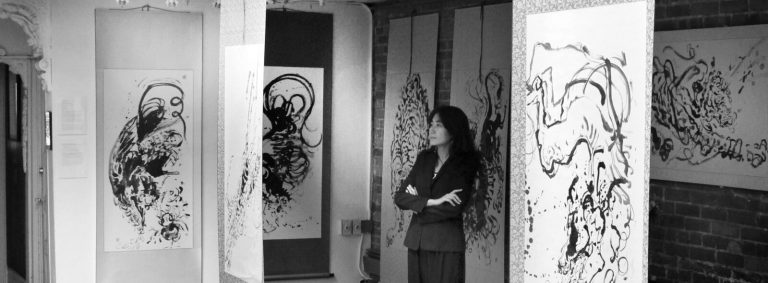 Anita Yan Wong: Anita Yan Wong with her artworks, 2020, photo courtesy of the artist.

