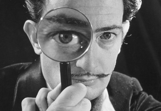 Salvador Dali weird things: Salvador Dali with a magnifying glass. Artnet. Detail.
