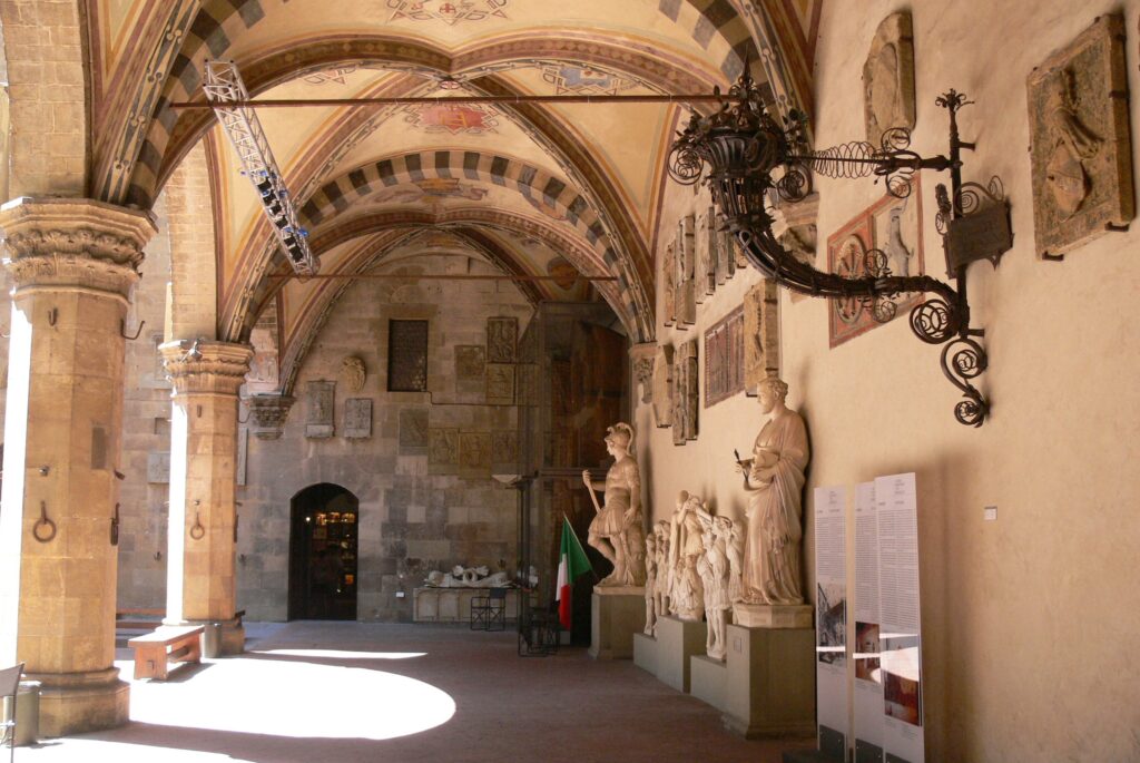 Bargello: Portico around the courtyard, Bargello National Museum, Florence, Italy. Photo by Wolfgang Sauber, 2012 via Wikimedia Commons (CC-BY-SA-3.0).
