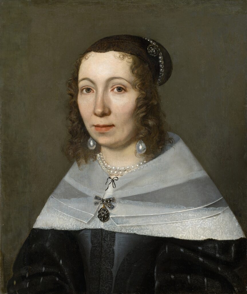 3/4 portrait of Caucasian woman with dark hair, dark dress with white sheer shoulder wrap, and pearl earrings. Dutch Golden Age Women