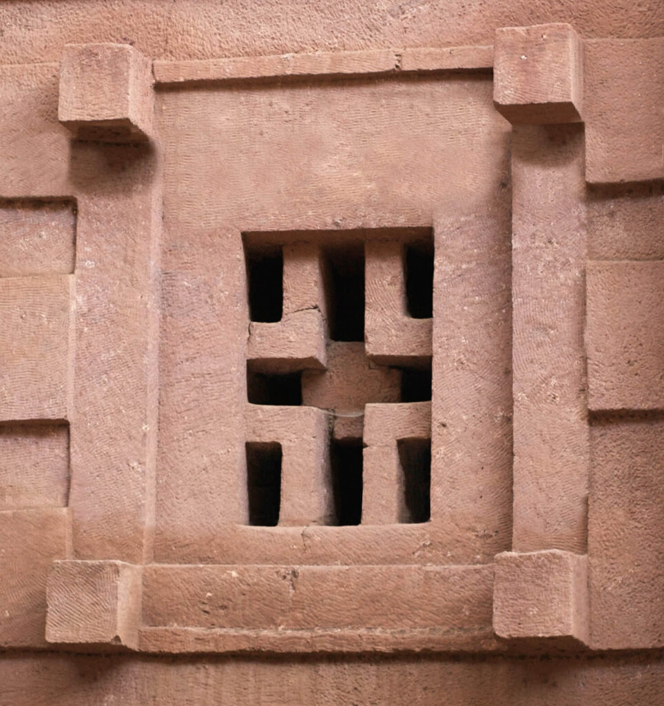 churches lalibela: A cruciform window at Biete Amanuel in Lalibela, Ethiopia. Photo by A. Davey via Wikimedia Commons (CC BY 2.0).
