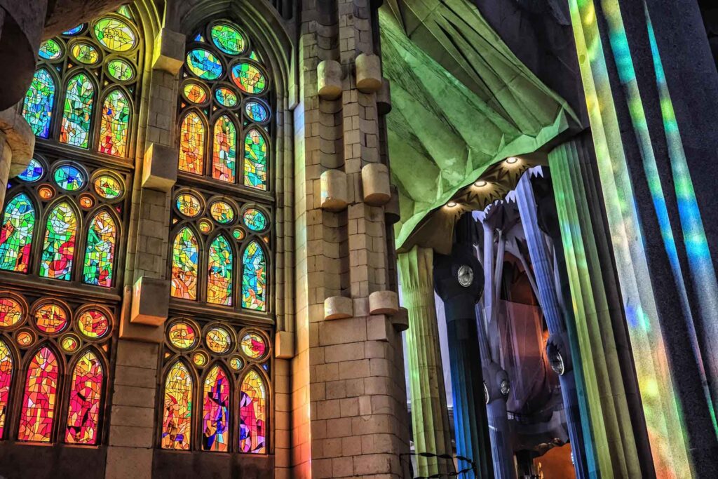 stained glass windows: Designed by Antoni Gaudí and realized by glazier Joan Vila-Grau, Detail of stained glass windows, Sagrada Familia, Barcelona, Spain. Wanderlosttraveller.
