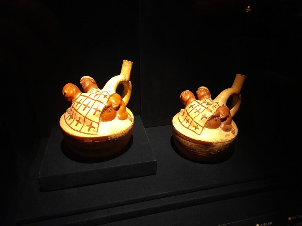 Sculptural clay bottles depicting a couple under a blanket, Moche culture, Museo Larco