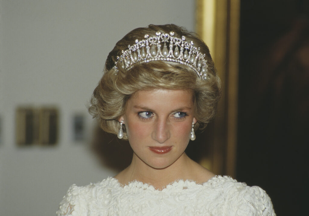 Beautiful Tiaras: Princess Diana wearing The Lover’s Knot Tiara. Photo by Terry Fincher/ Princess Diana Archive/ Getty Images via Showbiz CheatSheet.
