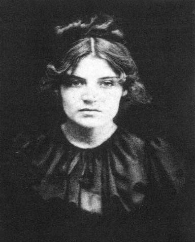 Suzanne Valadon Barnes Foundation: Photo of Suzanne Valadon. Black and white photograph of a white woman looking directly at the camera. Image is shown from the chest up. She has dark hair parted and pulled up in the back.