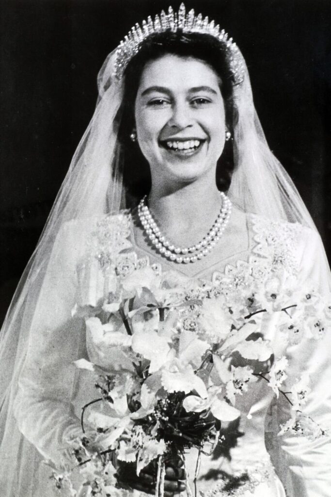 Beautiful Tiaras: The Queen, then Princess Elizabeth, wearing the Fringe Tiara on her wedding day to Prince Philip in 1947. Rachael Dickzen.
